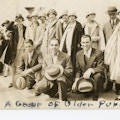 Description handwritten on group photograph of men and women both kneeling and standing reads: Group of Older Pupils.