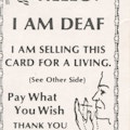 Card with American flag, text, and drawing of face and hand.