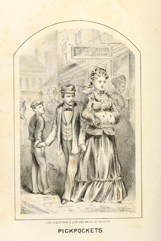 Man reaches into a lady's pocket on a city street.
