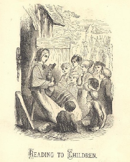 A woman sits and reads to a group of children.