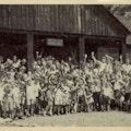 Group photograph of campers waving.  One child is circled in pen and labelled Me.