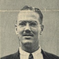 A photograph of a young man with glasses.