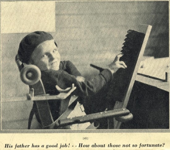 A boy sitting in a chair.