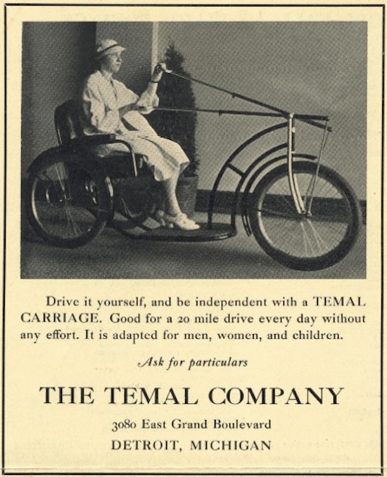 A woman operates a wheelchair.