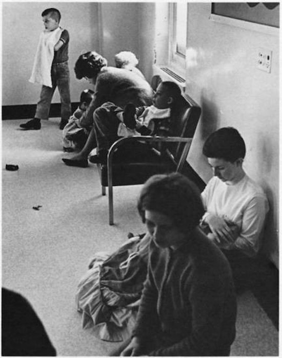 People sitting in a hall.