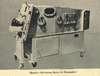 A man lies inside an early respirator machine.