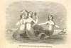 Three mermaids on an ocean rock, one holding a hand mirror.