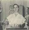 A young man plays chess with assitive technology.