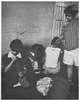 Four children in a dilapidated room.