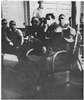 Men in chairs on a ward.