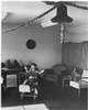 A boy in a room with Christmas decorations.