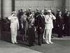 King George, Franklin Roosevelt, Eleanor Roosevelt stand with military personnel, many saluting, at Union Station.