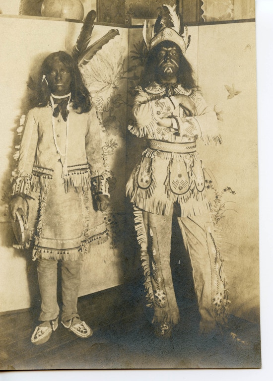 Photograph of two students at the Wright Oral School dressed as Native Americans.