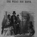 A well dressed family visits a man who is in a cage