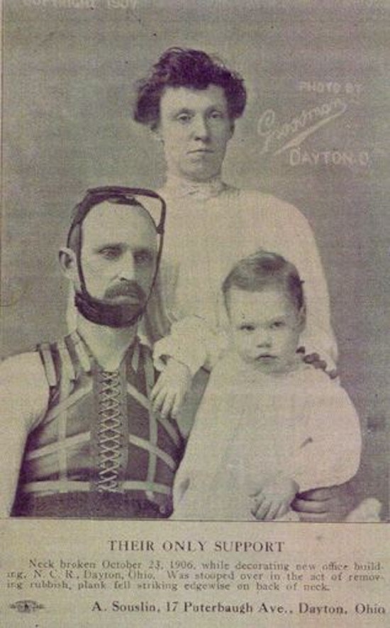 A man, woman and child pose for a family portrait; man is wearing neck/head brace.