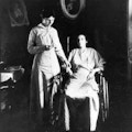 Woman in wheelchair having her pulse taken by nurse