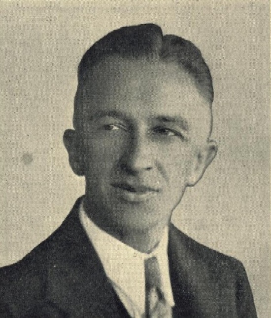 A photograph of a young man wearing a tie.