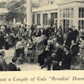 People in a courtyard, many in wheelchairs, playing instruments.
