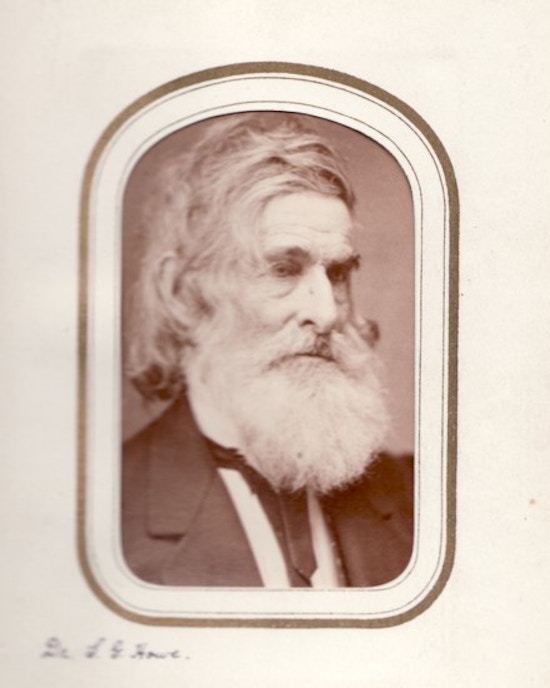 Samuel Gridley Howe, waist-up portrait, dark suit, gray hair and beard.